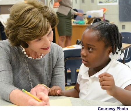 Picture of Laura Bush with a young child