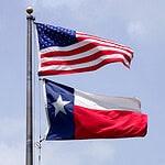 Photo of U.S. Flag and Texas Flag on same flagpole.