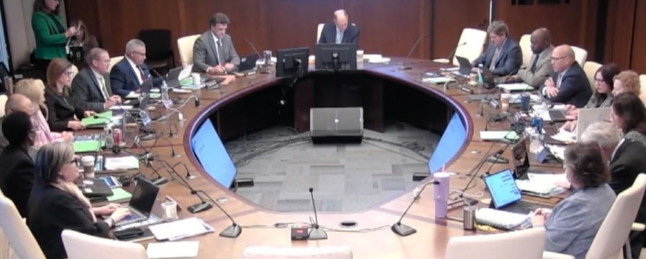 Image: TRS Board members meeting around board table. Screen Shot
