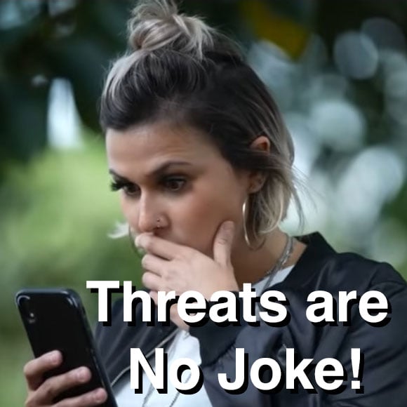 thumbnail photo- girl looking alarmed at phone, with text: Threats are No Joke!